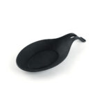 Black silicone spoon rest designed to keep countertops clean while cooking.
