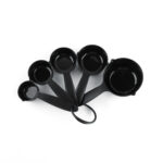 Set of five black measuring cups with ring holder for accurate cooking and baking measurements.